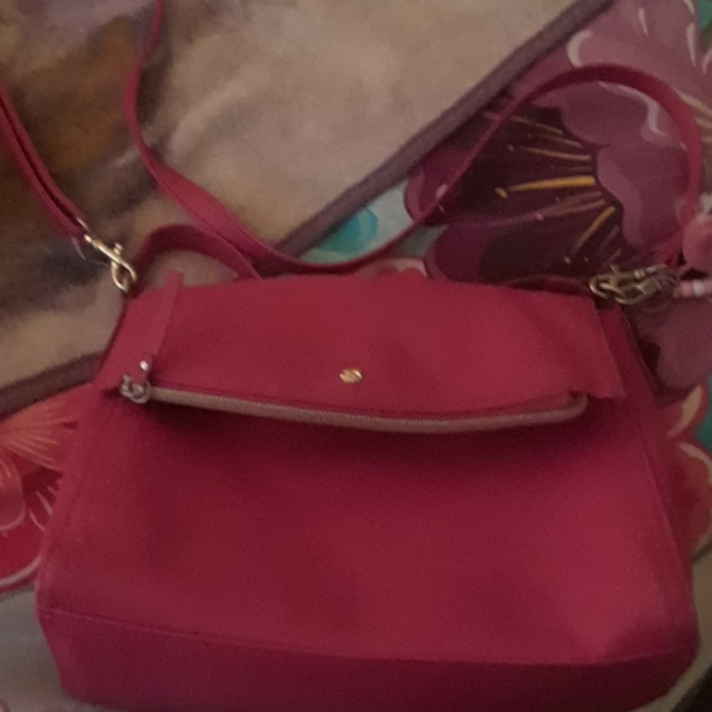 A hot pink sholder strap purse